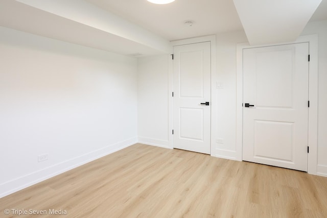 7939 Neva Ave, Burbank, IL 60459 - unfurnished bedroom with light wood-style floors and baseboards