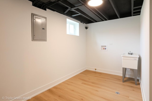 7939 Neva Ave, Burbank, IL 60459 - washroom with electric panel, light wood finished floors, and washer hookup
