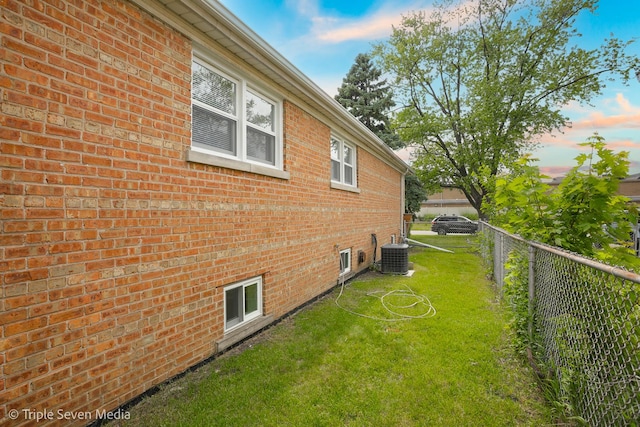 7939 Neva Ave, Burbank, IL 60459 - property exterior at dusk featuring brick siding and a cooling unit