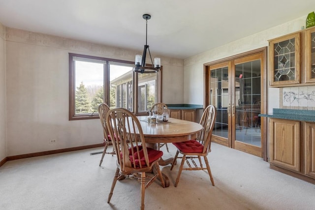 41W072 Bowes Rd, Elgin, IL 60124 - dining area with light carpet, a chandelier, and french doors