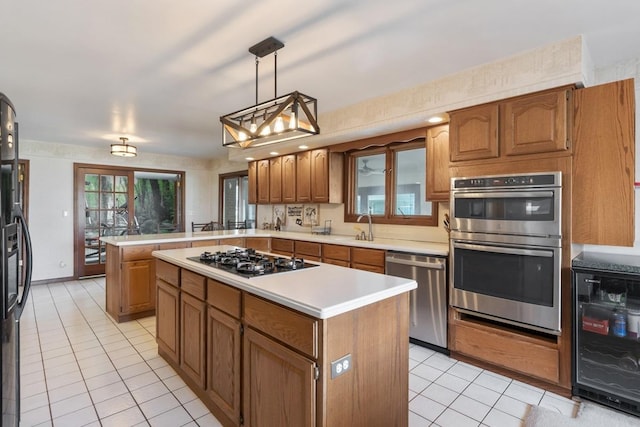 41W072 Bowes Rd, Elgin, IL 60124 - kitchen featuring black appliances, wine cooler, light tile patterned floors, and a peninsula