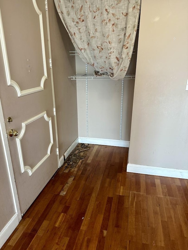 7033 N Kedzie Ave Unit 701, Chicago, IL 60645 - walk in closet featuring hardwood / wood-style floors