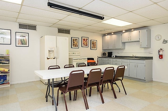 7033 N Kedzie Ave Unit 701, Chicago, IL 60645 - dining room with a drop ceiling and light flooring