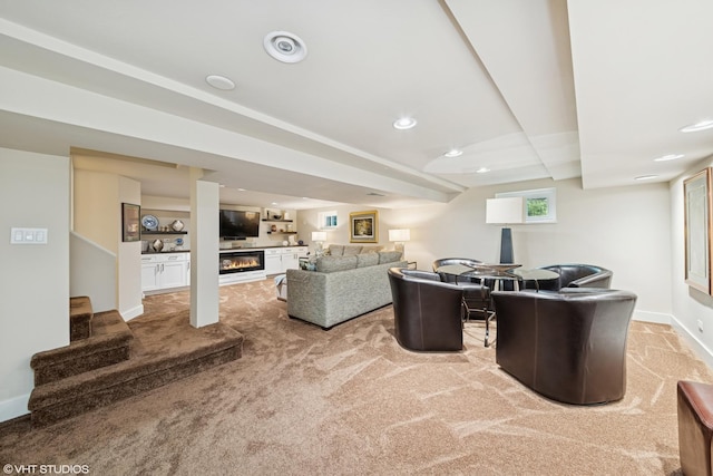 316 S Reuter Dr, Arlington Heights, IL 60005 - carpeted living room featuring a glass covered fireplace, stairs, and recessed lighting