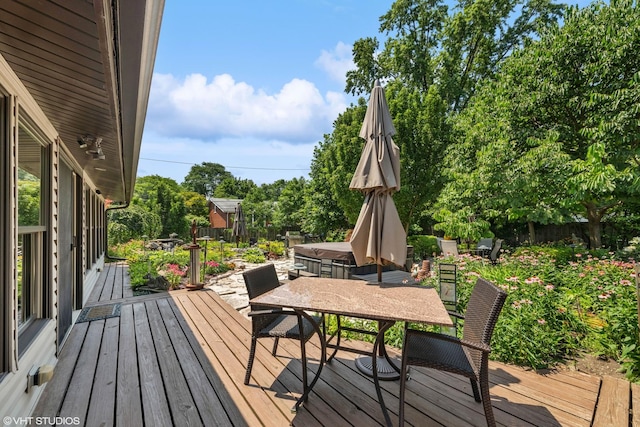 316 S Reuter Dr, Arlington Heights, IL 60005 - wooden deck with a hot tub, outdoor dining space, and view of wooded area
