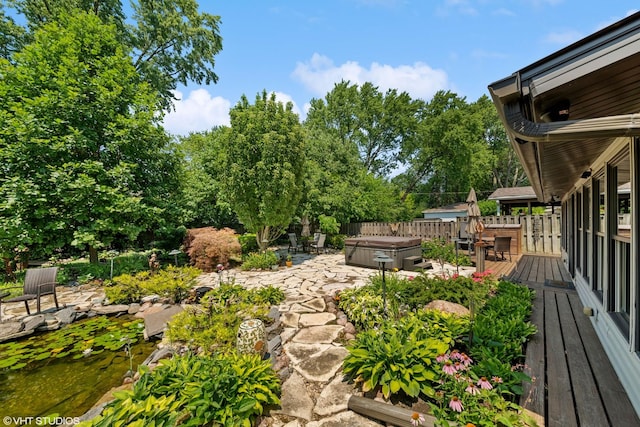 316 S Reuter Dr, Arlington Heights, IL 60005 - view of yard with a hot tub, a patio area, a deck, and a garden pond
