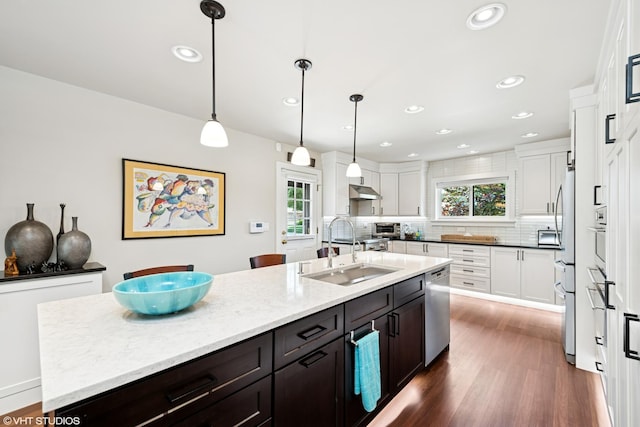 316 S Reuter Dr, Arlington Heights, IL 60005 - kitchen featuring backsplash, white cabinetry, plenty of natural light, dark wood finished floors, and recessed lighting