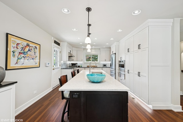 316 S Reuter Dr, Arlington Heights, IL 60005 - kitchen featuring appliances with stainless steel finishes, dark wood finished floors, recessed lighting, and white cabinetry