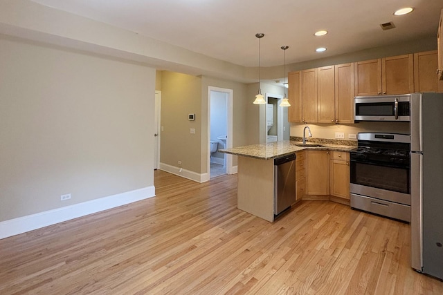 76351/2 N Greenview Ave Unit 1S, Chicago, IL 60626 - kitchen featuring appliances with stainless steel finishes, a peninsula, light wood finished floors, recessed lighting, and decorative light fixtures