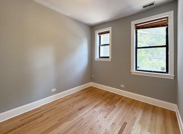 76351/2 N Greenview Ave Unit 1S, Chicago, IL 60626 - empty room featuring light wood-style flooring and baseboards