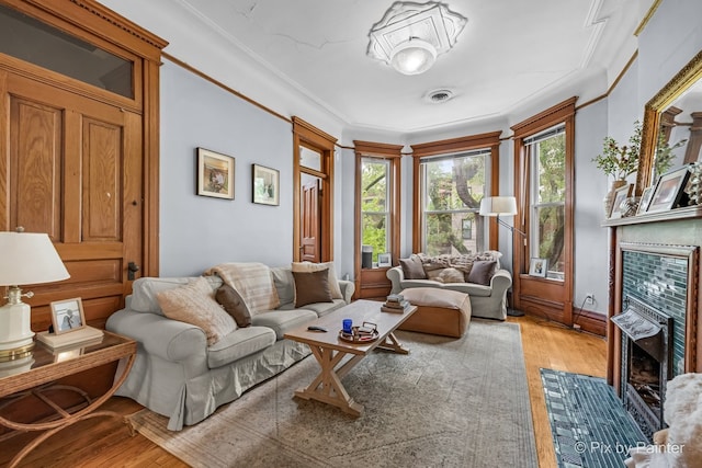 3516 N Reta Ave, Chicago, IL 60657 - living room with light wood finished floors and a fireplace with flush hearth