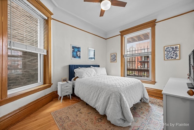 3516 N Reta Ave, Chicago, IL 60657 - bedroom with multiple windows, light wood-style floors, and ceiling fan