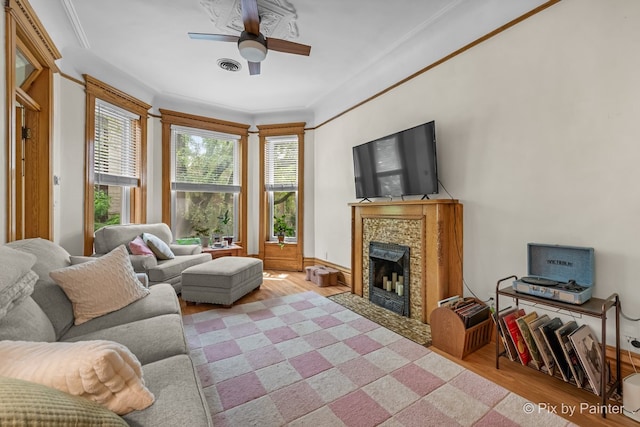 3516 N Reta Ave, Chicago, IL 60657 - living room with wood finished floors, a ceiling fan, a fireplace with flush hearth, and ornamental molding