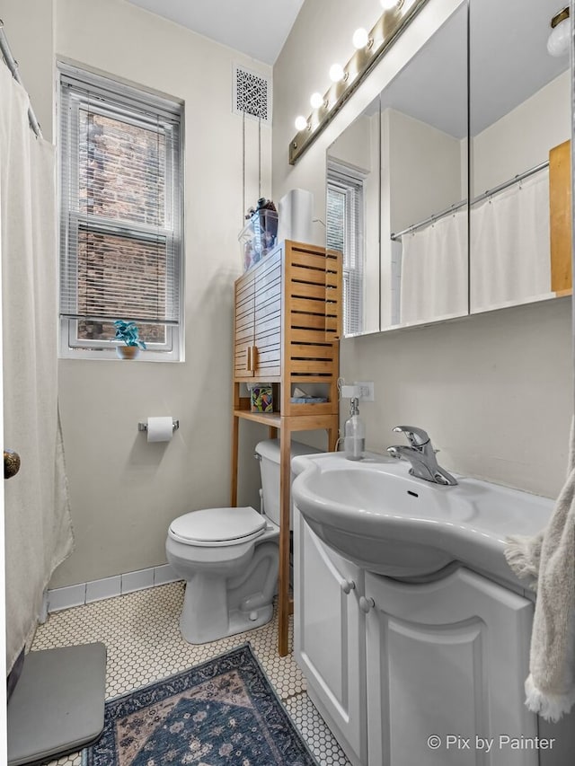3516 N Reta Ave, Chicago, IL 60657 - full bathroom with vanity and tile patterned flooring