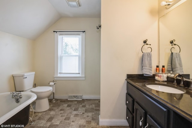 609 N 7th St, Dekalb, IL 60115 - full bathroom with a freestanding bath, vanity, lofted ceiling, and stone finish floors