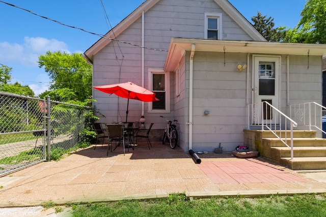 609 N 7th St, Dekalb, IL 60115 - back of property with a patio