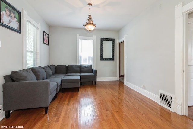 609 N 7th St, Dekalb, IL 60115 - living area featuring healthy amount of natural light and light wood-style floors