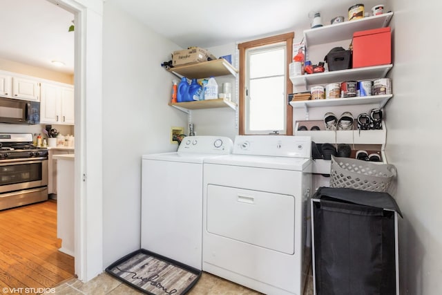 609 N 7th St, Dekalb, IL 60115 - washroom with separate washer and dryer and light wood-style flooring