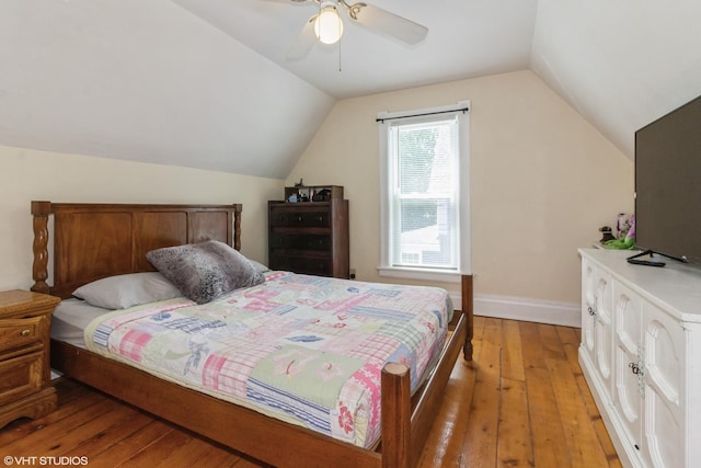 609 N 7th St, Dekalb, IL 60115 - bedroom with light wood finished floors, vaulted ceiling, and a ceiling fan