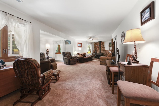 5955 E S Prairie Dr, Morris, IL 60450 - carpeted living area with a ceiling fan, baseboard heating, and a fireplace