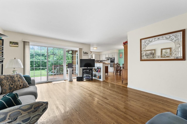 1207 W Busse Ave, Mount Prospect, IL 60056 - living room featuring light wood-type flooring and baseboards