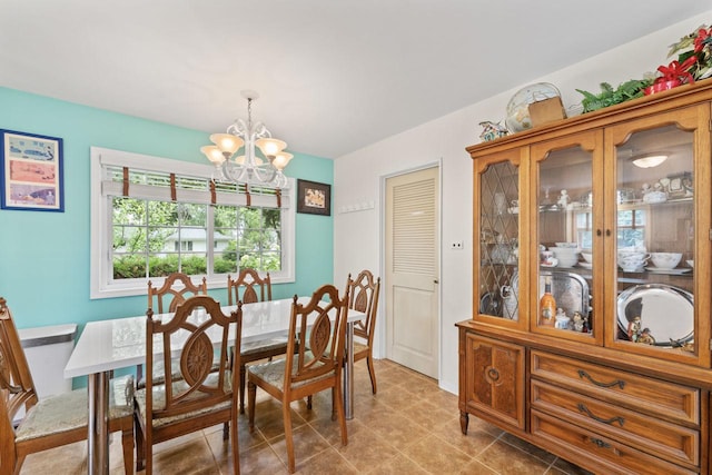 1207 W Busse Ave, Mount Prospect, IL 60056 - dining area with a chandelier and light tile patterned flooring