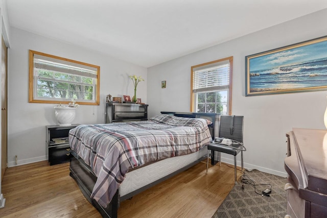 1207 W Busse Ave, Mount Prospect, IL 60056 - bedroom with baseboards and wood finished floors