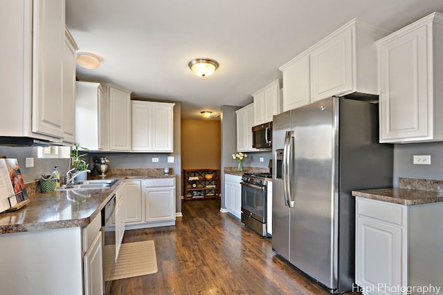 218 Minuet Cir, Volo, IL 60073 - kitchen featuring stainless steel appliances, dark wood-type flooring, white cabinetry, and dark countertops