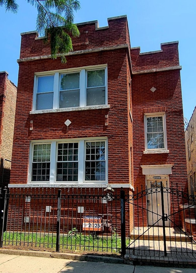 6011 S Troy St, Chicago, IL 60629 - view of front of home with a fenced front yard and brick siding