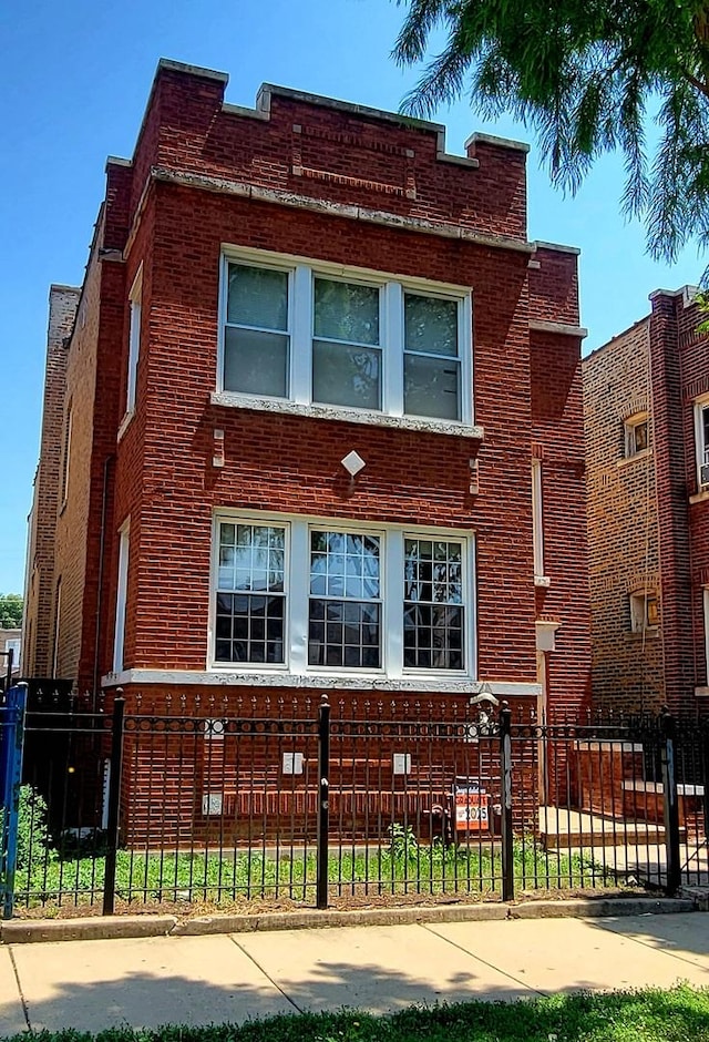 6011 S Troy St, Chicago, IL 60629 - view of front of home with brick siding and a fenced front yard