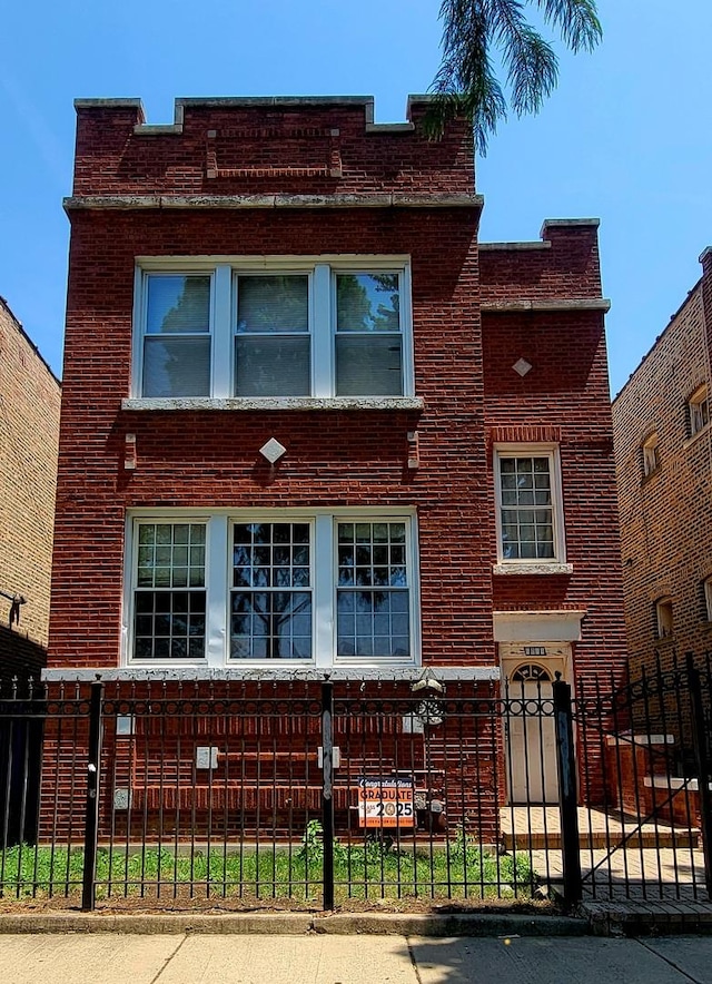 6011 S Troy St, Chicago, IL 60629 - view of front of property with brick siding and a fenced front yard