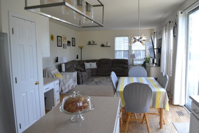 4355 Barharbor Dr, Lake In The Hills, IL 60156 - dining area with a chandelier and wood finished floors