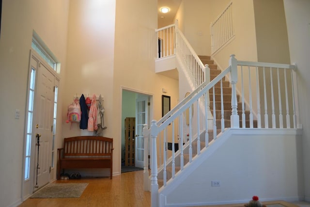 4355 Barharbor Dr, Lake In The Hills, IL 60156 - entryway with a high ceiling, stairway, and wood finished floors