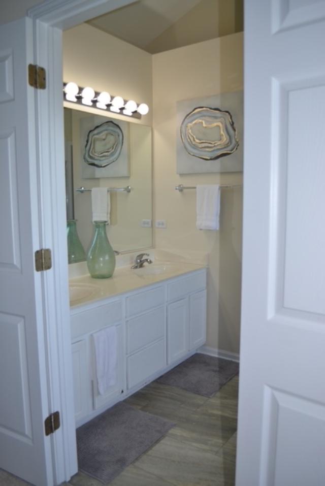 4355 Barharbor Dr, Lake In The Hills, IL 60156 - bathroom with double vanity and baseboards