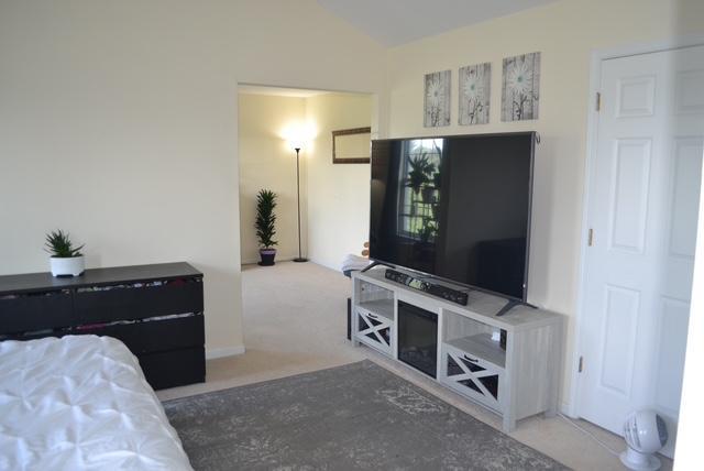 4355 Barharbor Dr, Lake In The Hills, IL 60156 - bedroom with lofted ceiling and carpet flooring