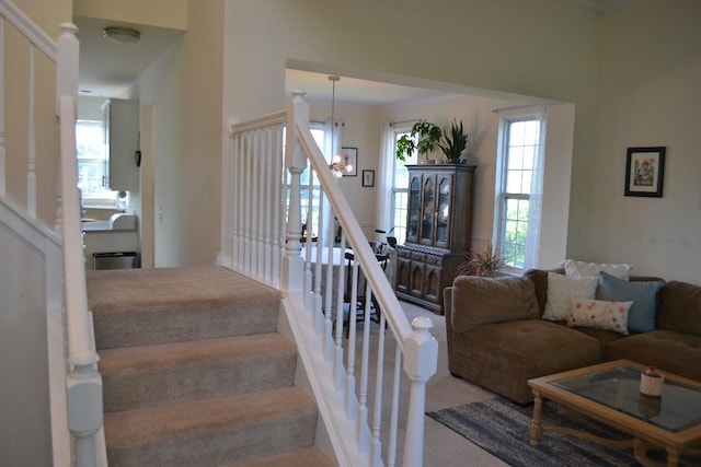 4355 Barharbor Dr, Lake In The Hills, IL 60156 - staircase featuring carpet floors and a chandelier