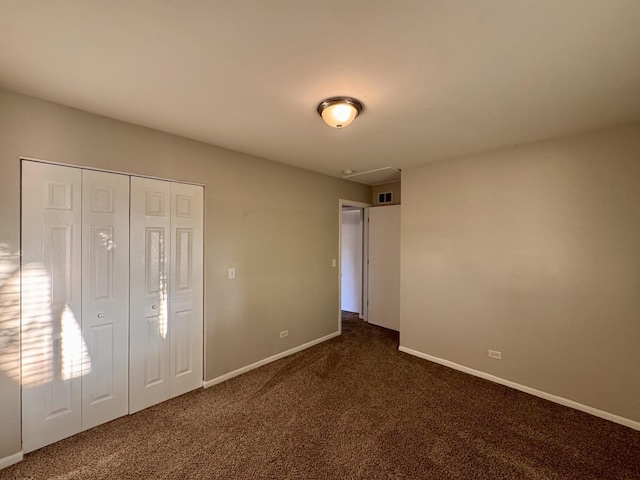 17303 Kedzie Ave, Hazel Crest, IL 60429 - unfurnished bedroom featuring dark colored carpet and a closet