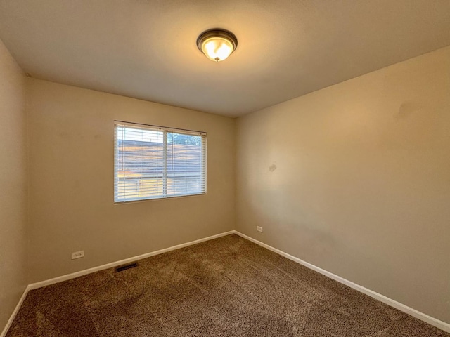 17303 Kedzie Ave, Hazel Crest, IL 60429 - empty room featuring dark carpet and baseboards