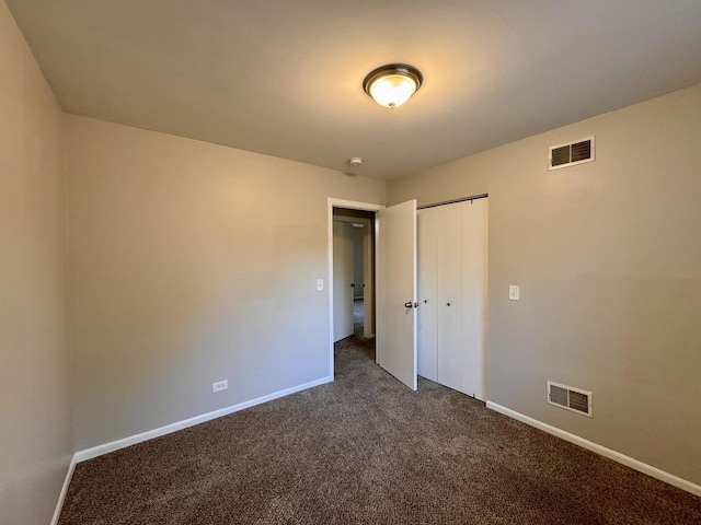 17303 Kedzie Ave, Hazel Crest, IL 60429 - unfurnished bedroom with dark carpet and a closet
