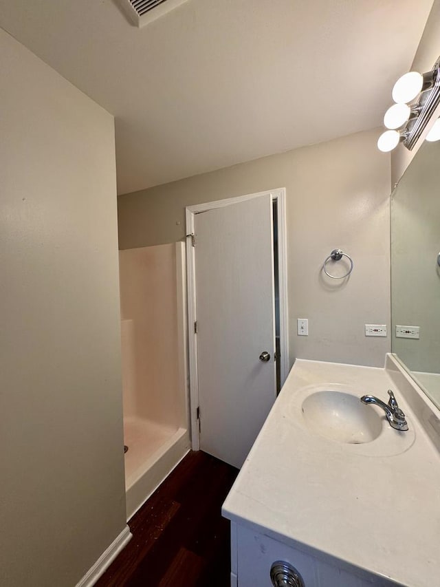17303 Kedzie Ave, Hazel Crest, IL 60429 - full bath with wood finished floors, vanity, and a shower stall
