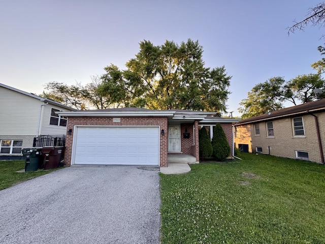 17303 Kedzie Ave, Hazel Crest, IL 60429 - view of front of home with asphalt driveway, brick siding, a front lawn, and an attached garage