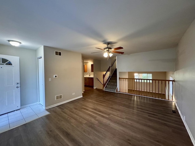17303 Kedzie Ave, Hazel Crest, IL 60429 - unfurnished living room with wood finished floors and a ceiling fan