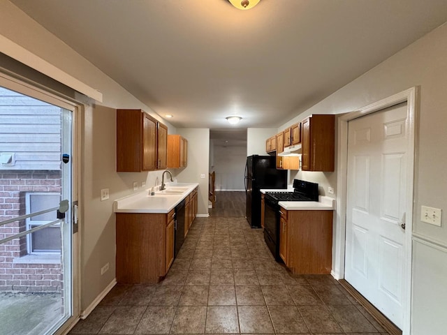 17303 Kedzie Ave, Hazel Crest, IL 60429 - kitchen with black appliances, light countertops, under cabinet range hood, and brown cabinetry