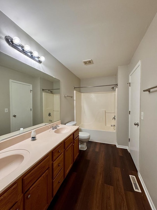17303 Kedzie Ave, Hazel Crest, IL 60429 - bathroom featuring wood finished floors, double vanity, and washtub / shower combination