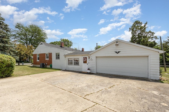 1723 N Raynor Ave, Crest Hill, IL 60403 - view of front facade with a chimney, concrete driveway, a front yard, an attached garage, and brick siding