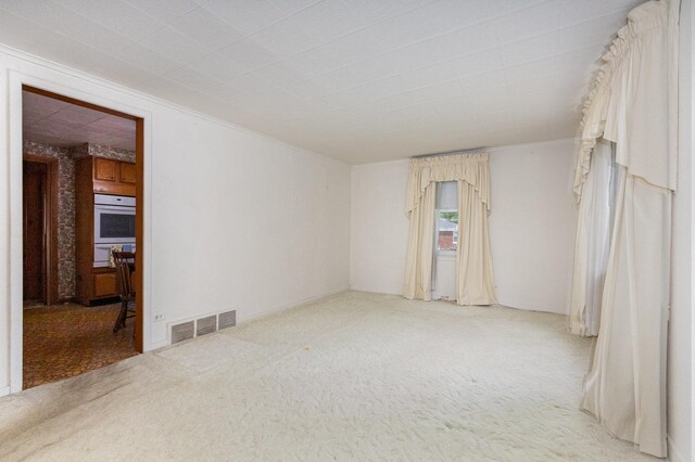 1723 N Raynor Ave, Crest Hill, IL 60403 - carpeted spare room with crown molding