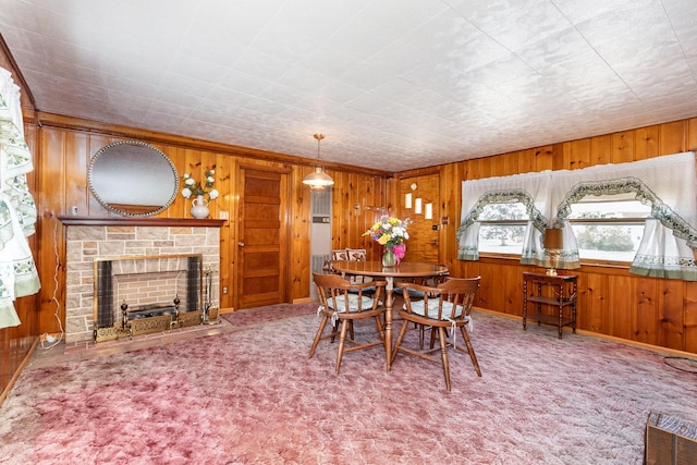 1723 N Raynor Ave, Crest Hill, IL 60403 - dining area with wood walls, a stone fireplace, and carpet flooring