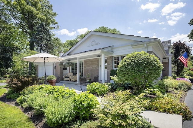 100 Beach Rd, Glencoe, IL 60022 - view of front of house featuring brick siding and a porch