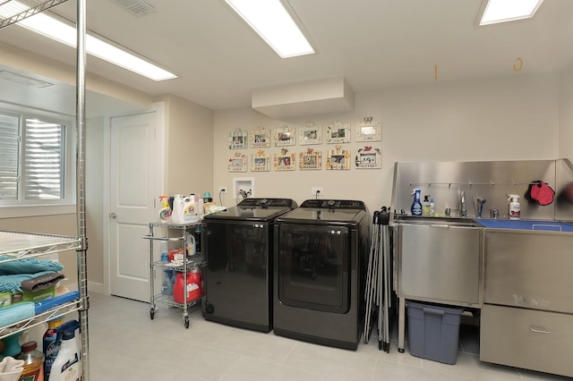 100 Beach Rd, Glencoe, IL 60022 - laundry room featuring separate washer and dryer and light tile patterned floors