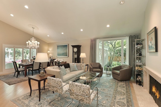 100 Beach Rd, Glencoe, IL 60022 - living area featuring a chandelier, recessed lighting, a high end fireplace, wood finished floors, and high vaulted ceiling